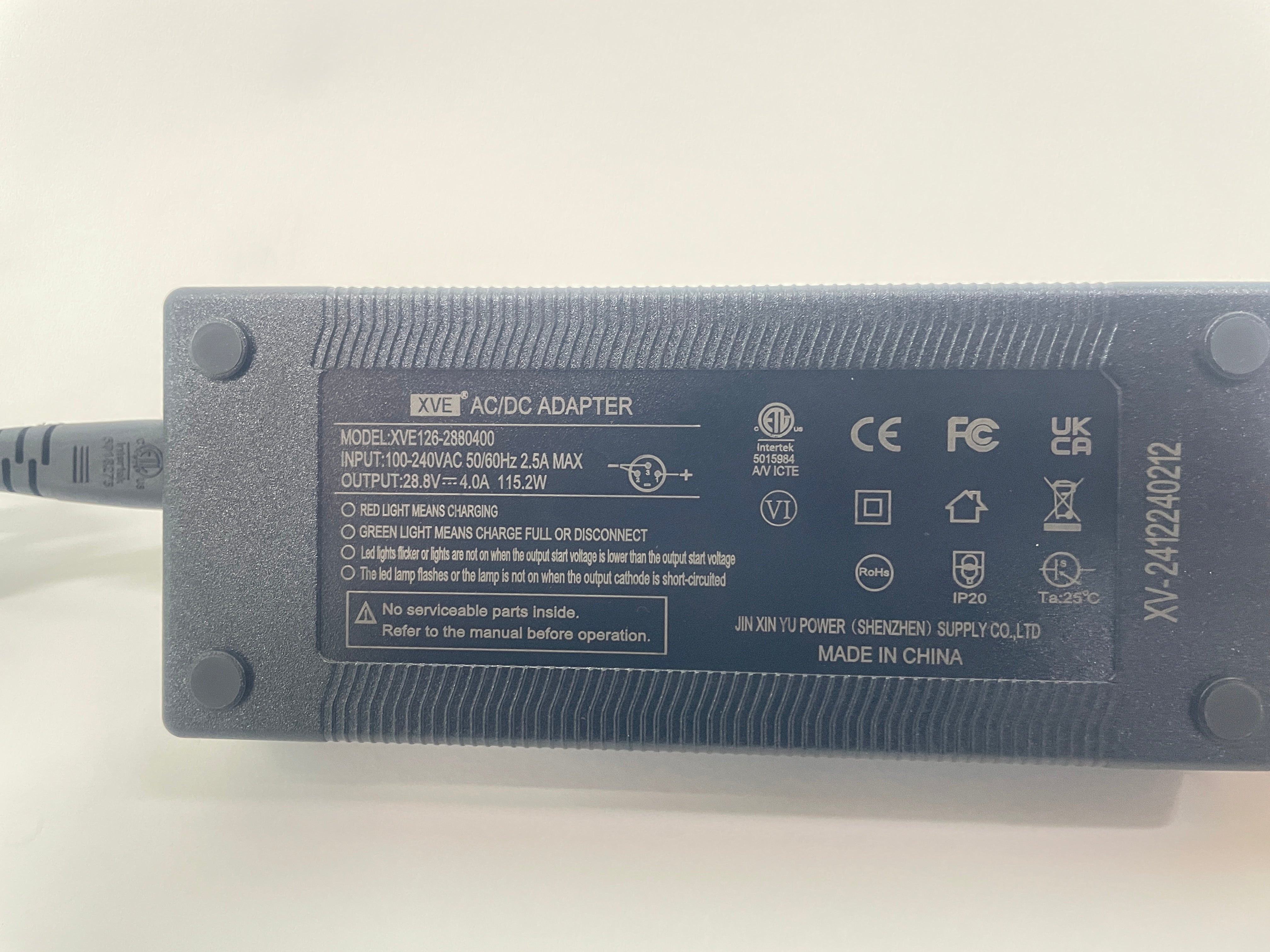 Black XVE AC/DC adapter for MS20 MAX scooters, showing input/output specs and safety certifications.