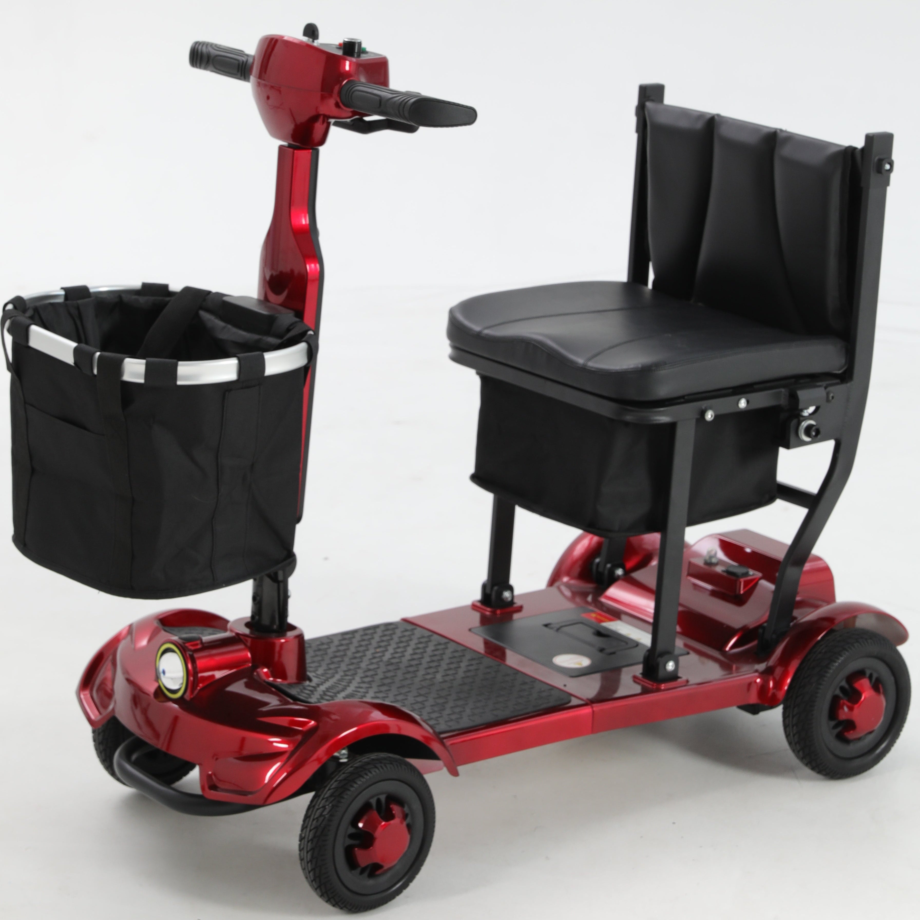 Red Mbxcooter M1F lightweight foldable travel scooter with black padded seat, front basket, and four wheels.