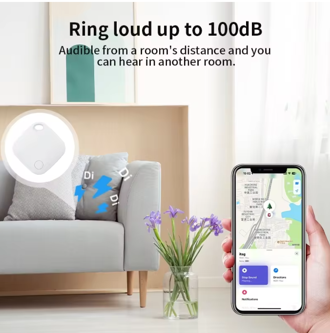 White Mbxcooter smart security locator tag on a gray sofa, with a phone displaying a map.